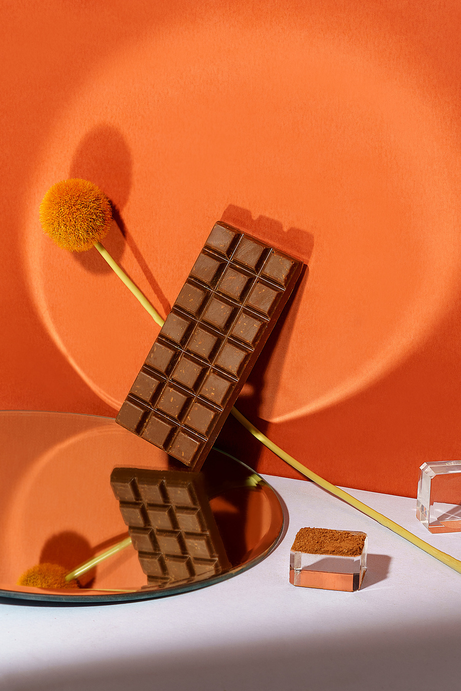 chocolate sitting on a mirror 