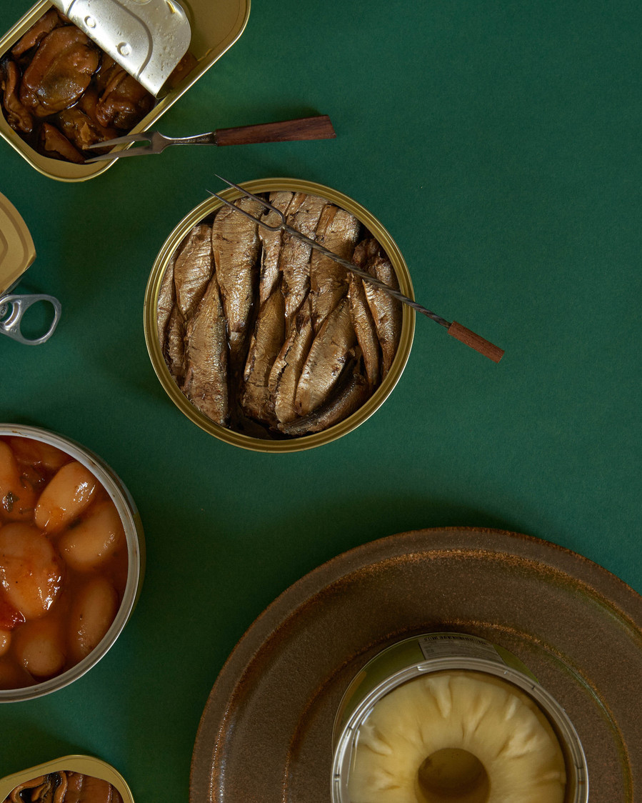 a few sardines can on a table