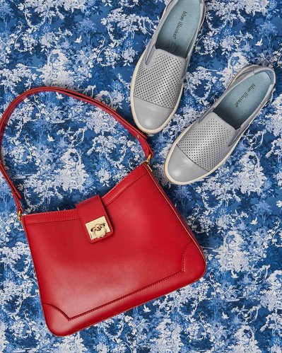 red bag and blue shoes on a blue background