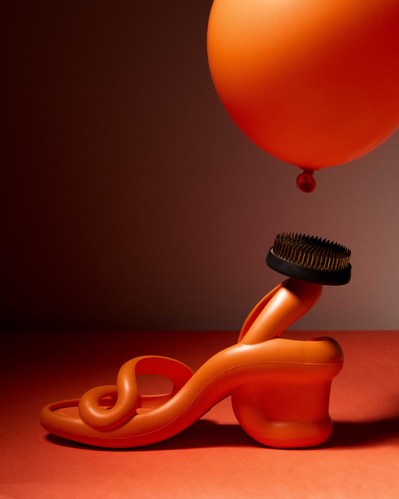 orange camper shoe with an orange balloon