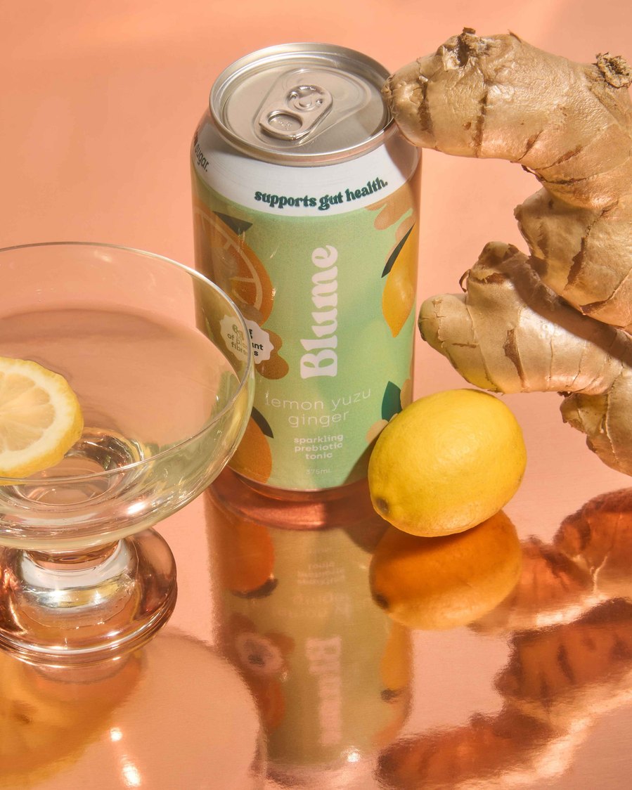 green kombucha can on a reflective background 