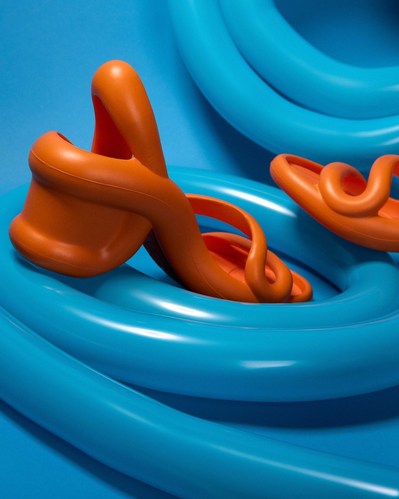 orange Camper shoe on a blue balloon