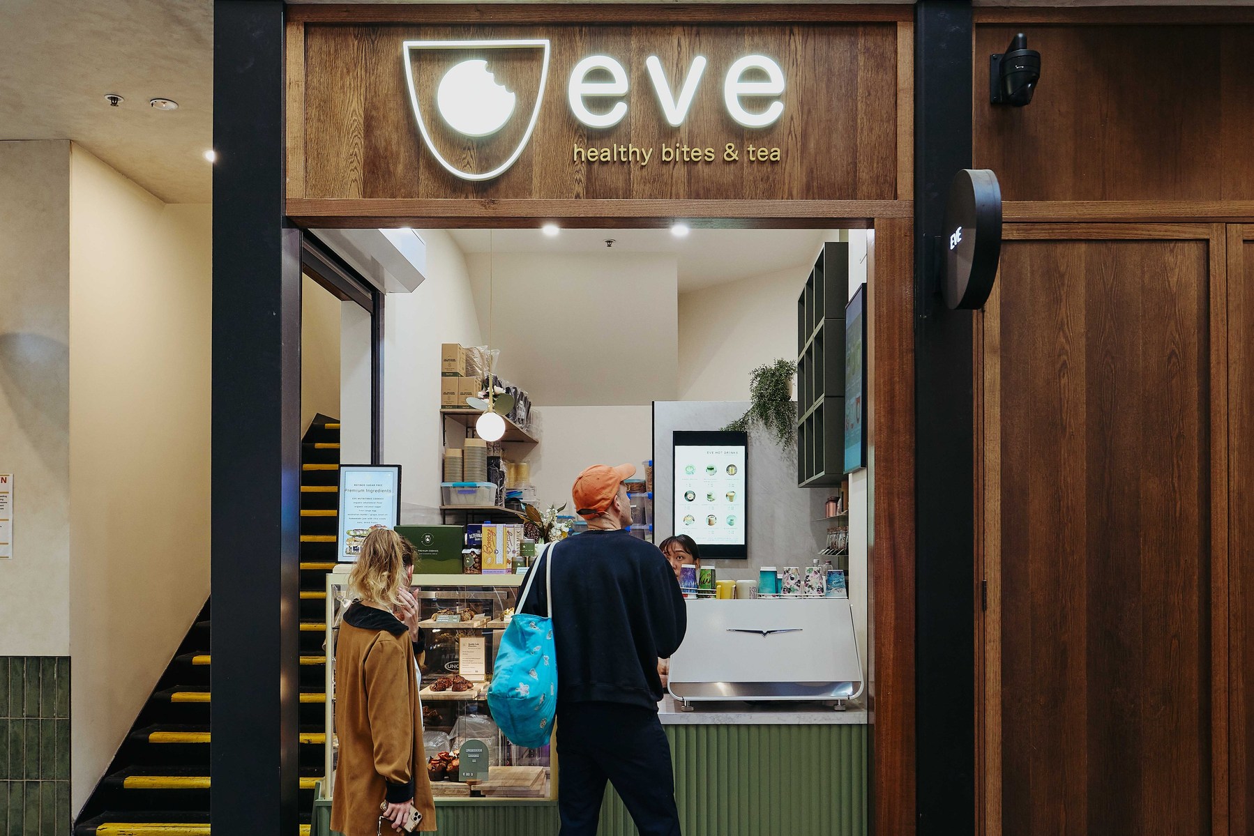 Cafe entrance with customers, photographed by Marcie Raw, Melbourne lifestyle photographer