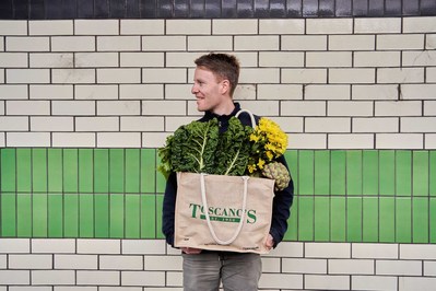 Smiling man holding Toscano's produce and flowers in Melbourne – branding lifestyle photography by Marcie Raw