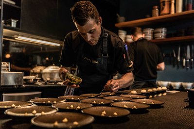a chef plating dishes
