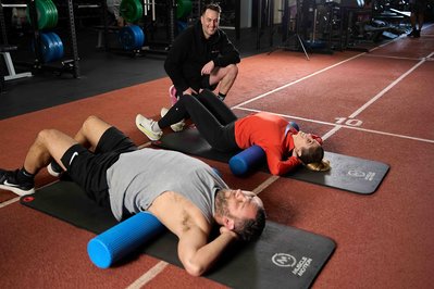 a trainer looking after the gum member during class