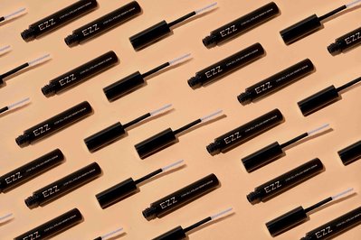 mascara packaging on a  a beige surface