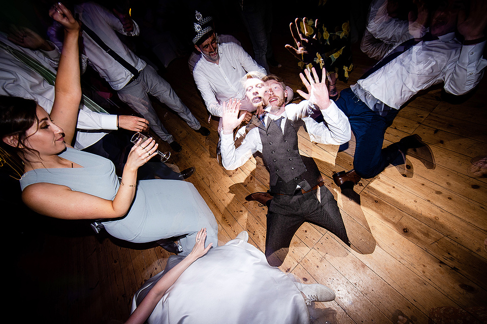 Celebrations for a couples wedding in the Lake District, people dance on the dance floor - Georgie Glass Photography