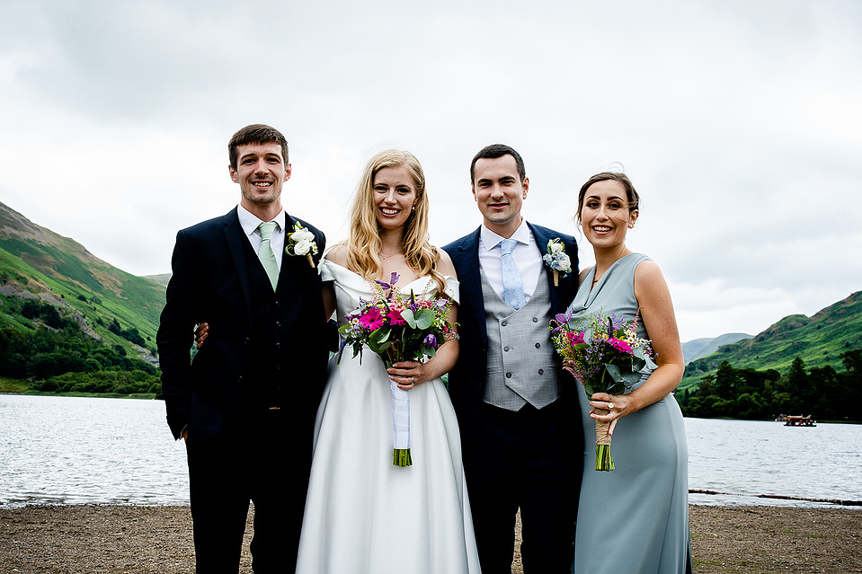 Celebrations for a couples wedding in the Lake District, bride with bouquet, husband, bridesmaids and groomsmen - Georgie Glass Photography