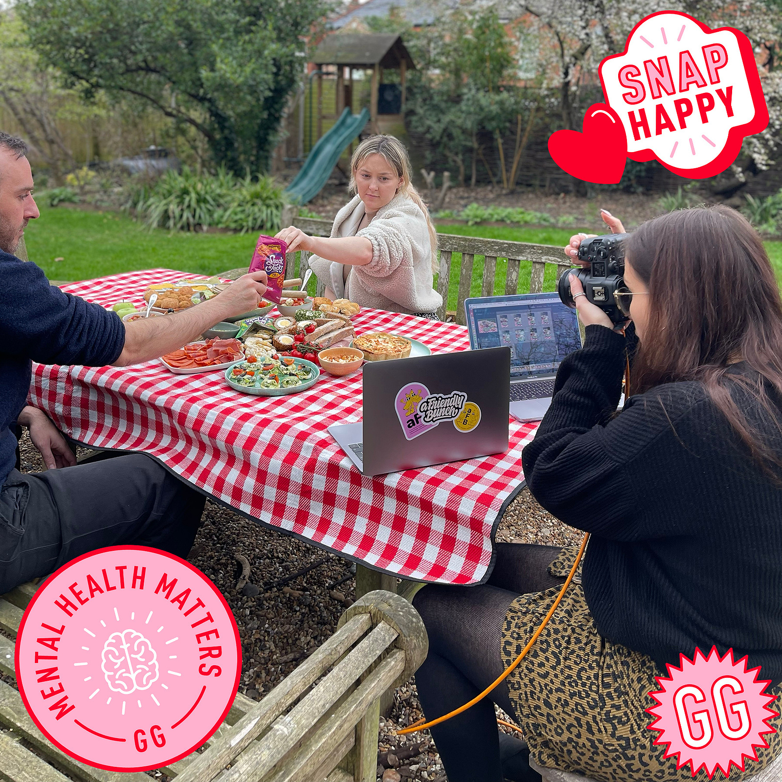 Photo of a picnic on a bench with a photographer taking photos. photo by Georgie Glass Photography, Manchester