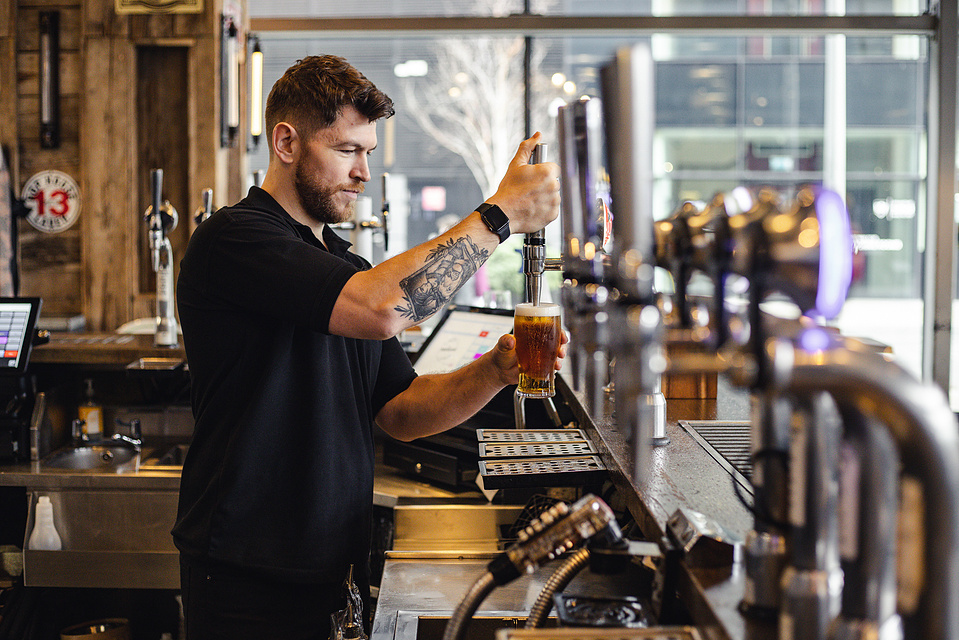 Georgie Glass Photography, product photographer, Manchester product photographer, Manchester portrait photographer, Beer Piper, portraiture, man in bar pulling a pint of beer