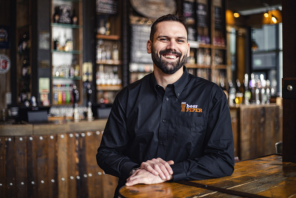 Georgie Glass Photography, product photographer, Manchester product photographer, Manchester portrait photographer, Beer Piper, portraiture, man leaning against a counter in a bar