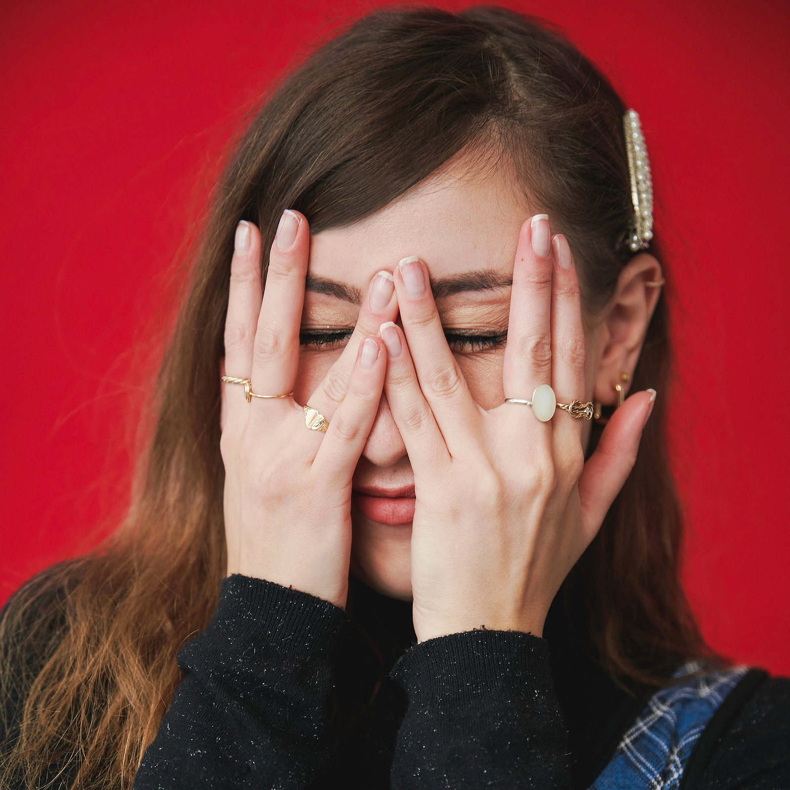 Portrait of photographer Georgie Glass Photographer - girl hides behind hands - Manchester based photographer and mental health advocate - We Are Hummingbird announcement