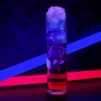 A tall glass of a layered cocktail with vivid blue and red neon light accents, reflecting a modern and sleek aesthetic, photographed by Georgie Glass in Manchester, UK, showcasing the drink's dynamic colors and enticing clarity.