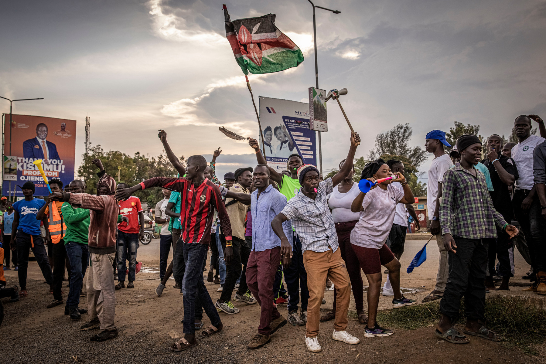 KISUMU, KENYA - AUGUST 15: People protest outside a police station after election results were announced on August 15, 2022 in Kisumu, Kenya. Some protesters could be heard shouting “No Raila, no peace” as they threw stones and looted shops in one of Rail