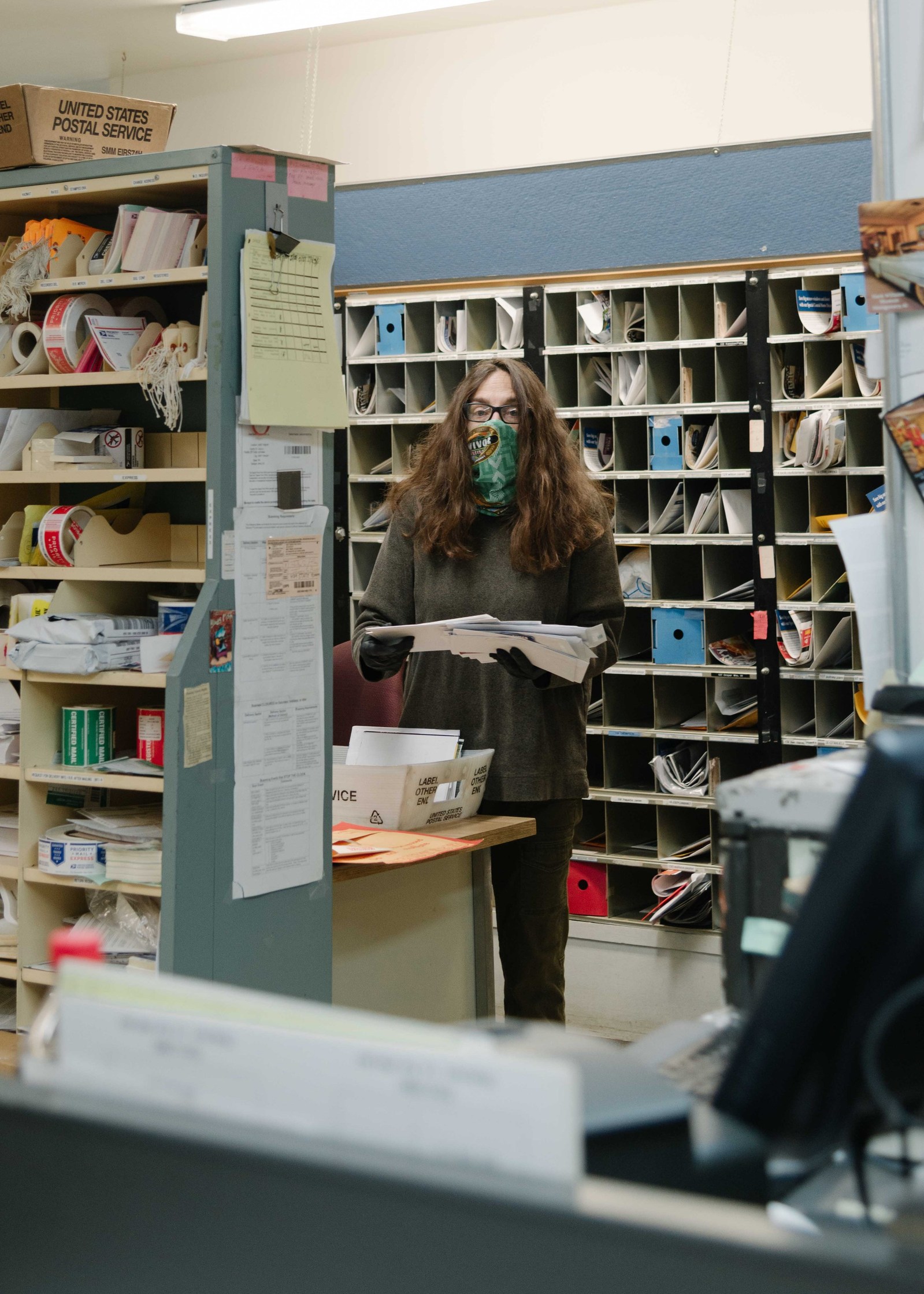 Diane Nolan at work at the West Tisbury Post Office.