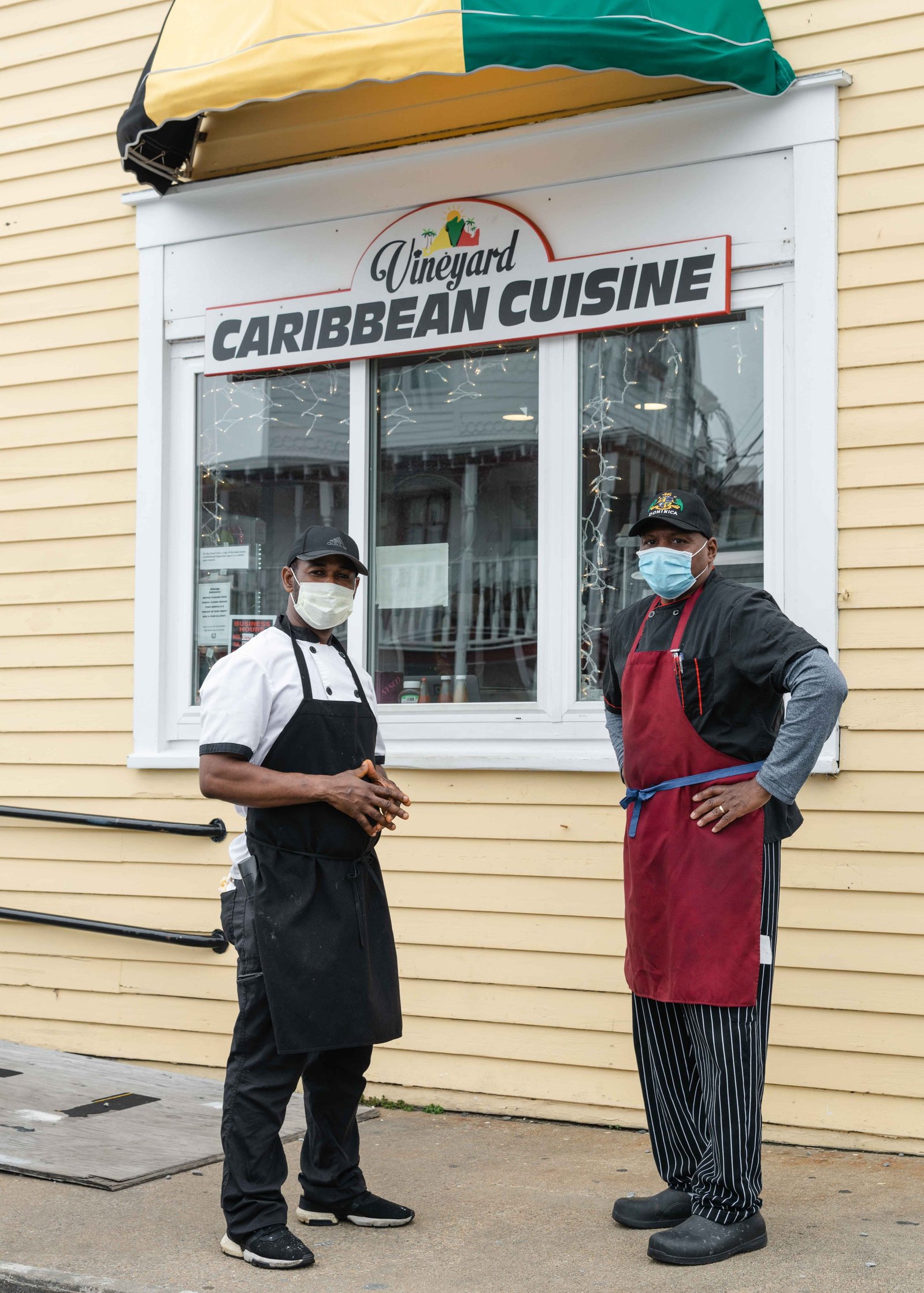Newton Waite (left) and
Anthony Foster (right), owners of Vineyard Caribbean Cuisine in Oak Bluffs. Foster expressed concerns about the effects of Covid-19 and the Oak Bluffs Ferry Terminal closure affecting summer business.