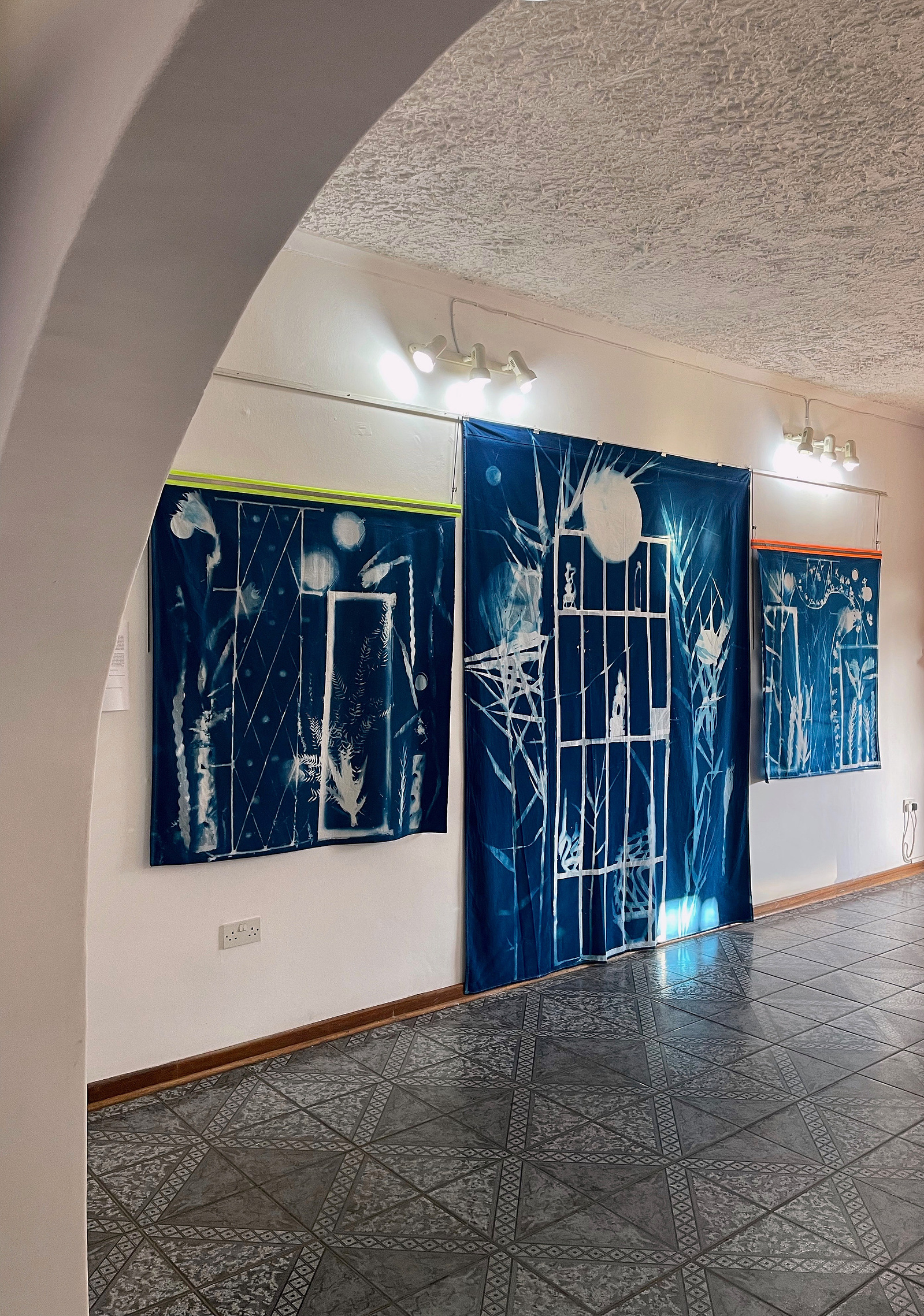 large scale cyanotypes on fabric by Nellie Appleby exhibited in Gaborone, Botswana