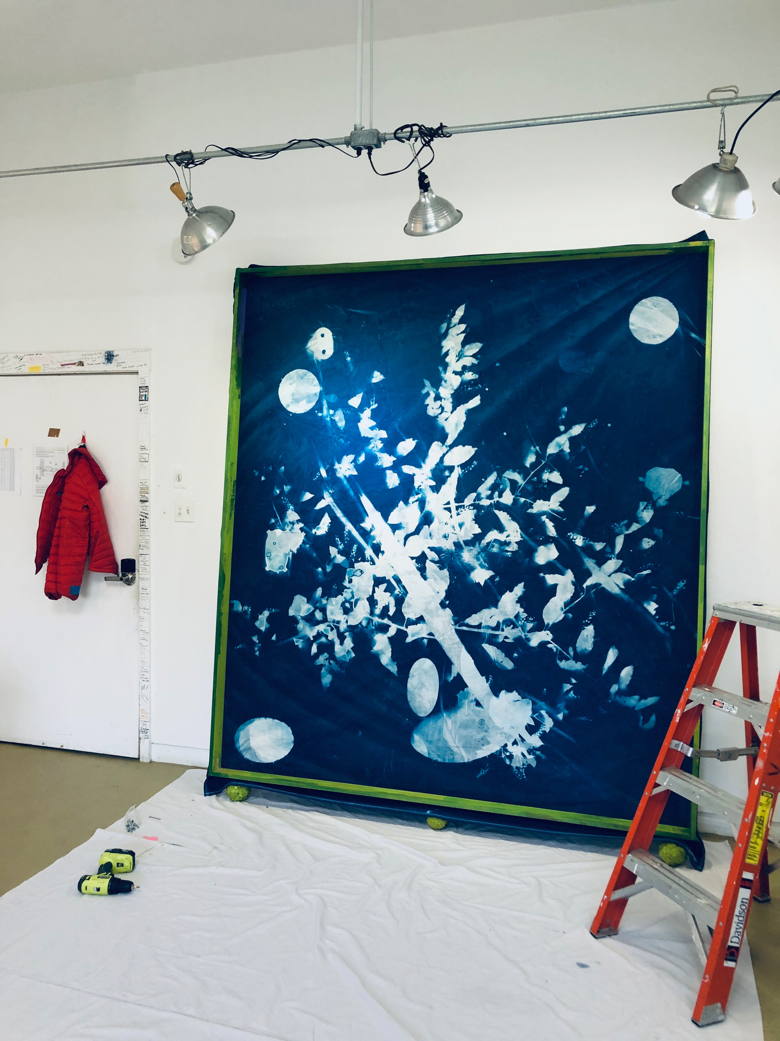 large scale cyanotype stretched on green stretcher in artist studio of Nellie Appleby at VCCA