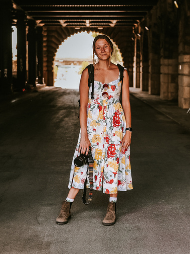 Brand photographer, Allie Bon, poses with her camera.