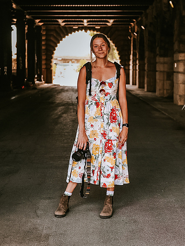 Brand photographer, Allie Bon, poses with her camera.