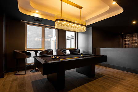 Spaces that indulge. A refined lounge where dark tones, soft lighting, and sculptural ceilings craft an atmosphere of understated luxury. Design that invites connection, captured through thoughtful framing. #InteriorElegance #AtmosphericDesign #Architectu