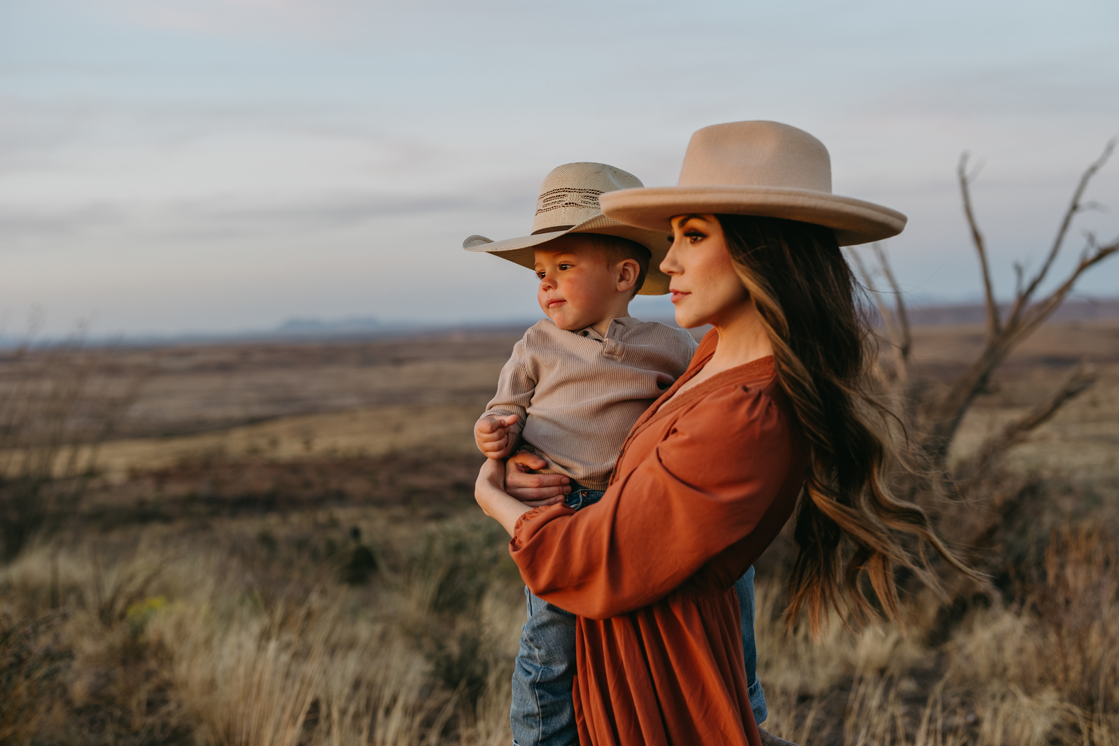 Mother and son, near Marfa Texas take photos together in the West Texas landscape, photos taken by Documentary style photographer Hannah Gentiles. 