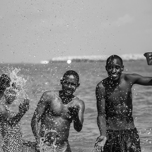 Beach goers having fun at Takwa bay beach, Lagos.