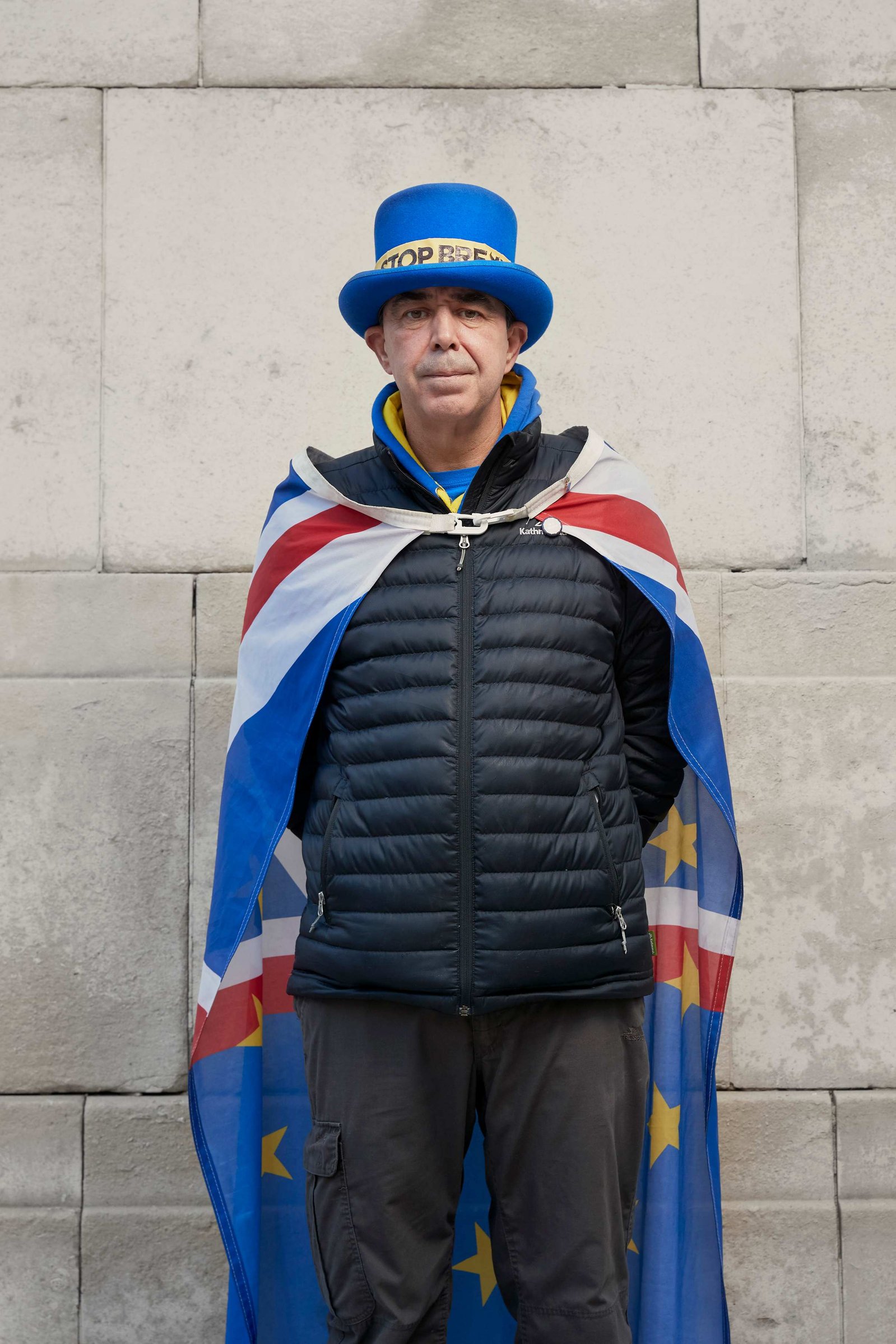 A portrait of Steve Bray, a Remainer, pro European, and anti Brexit protestor photographed dressed in a blue top hat and cloak outside the Houses of Parliament in Westminster, London.