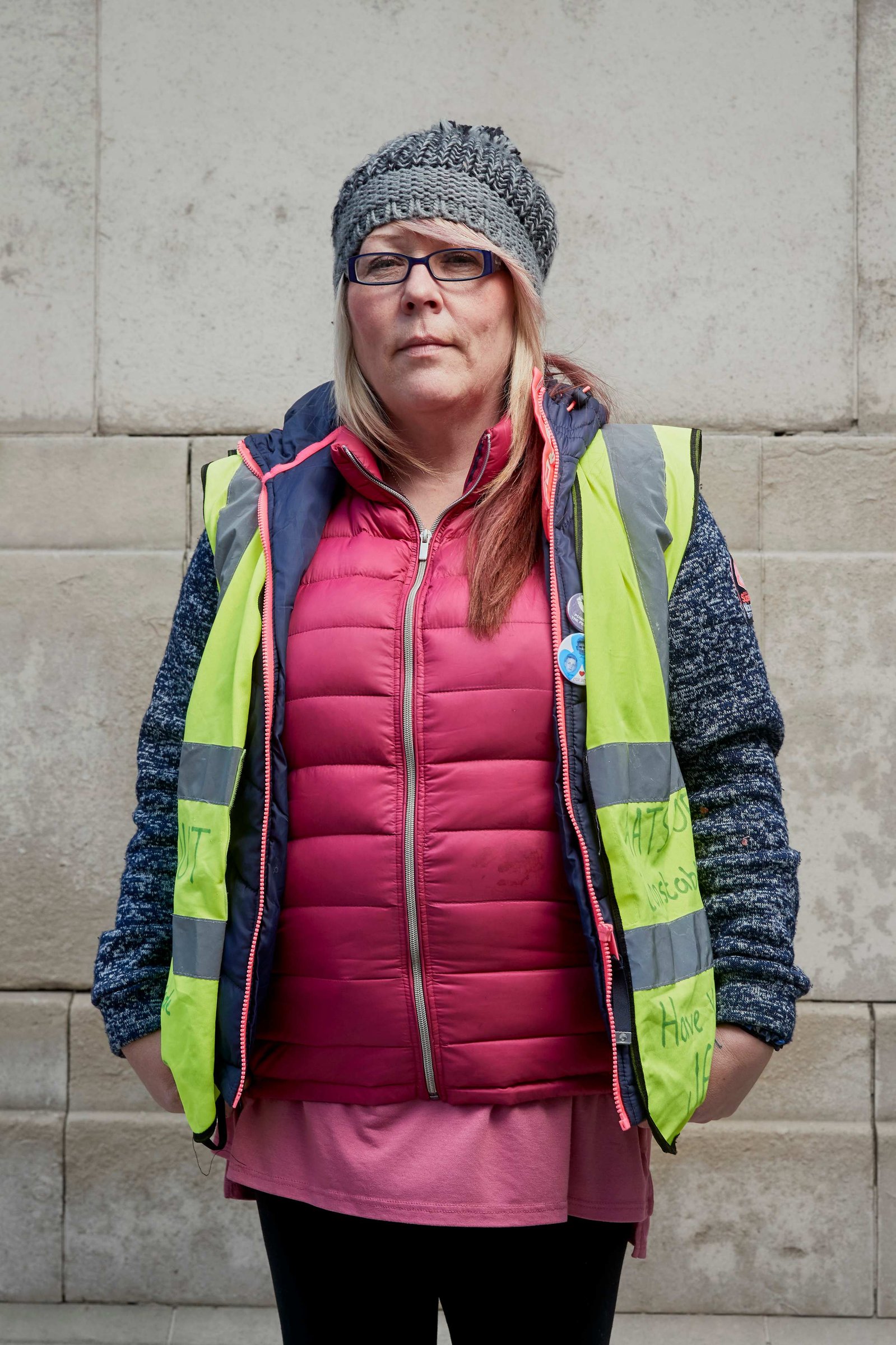 A portrait of Tracy Blackwell, a leaver, strong Brexit supporter and British Gilet Jaune photographed wearing a yellow vest outside the Houses of Parliament in Westminster, London.