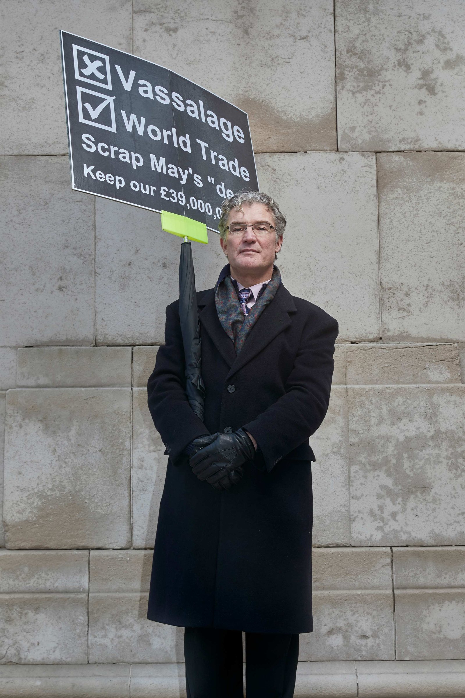 A portrait of Tony Blighe, a leaver and strong Brexit supporter photographed holding a pro Brexit placard outside the Houses of Parliament in Westminster, London.
