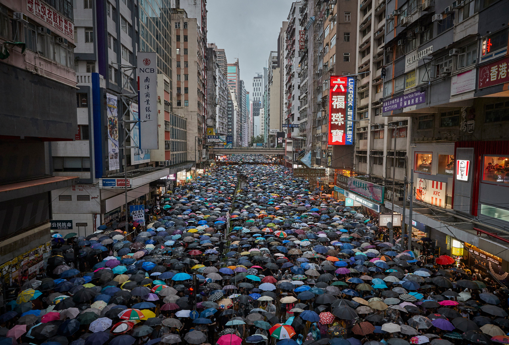 AUGUST 18, 2019: An estimated 1.7 million people march in the pouring rain in anti-government demonstrations in opposition to a planned extradition law that has since morphed into a wider call for democratic rights.