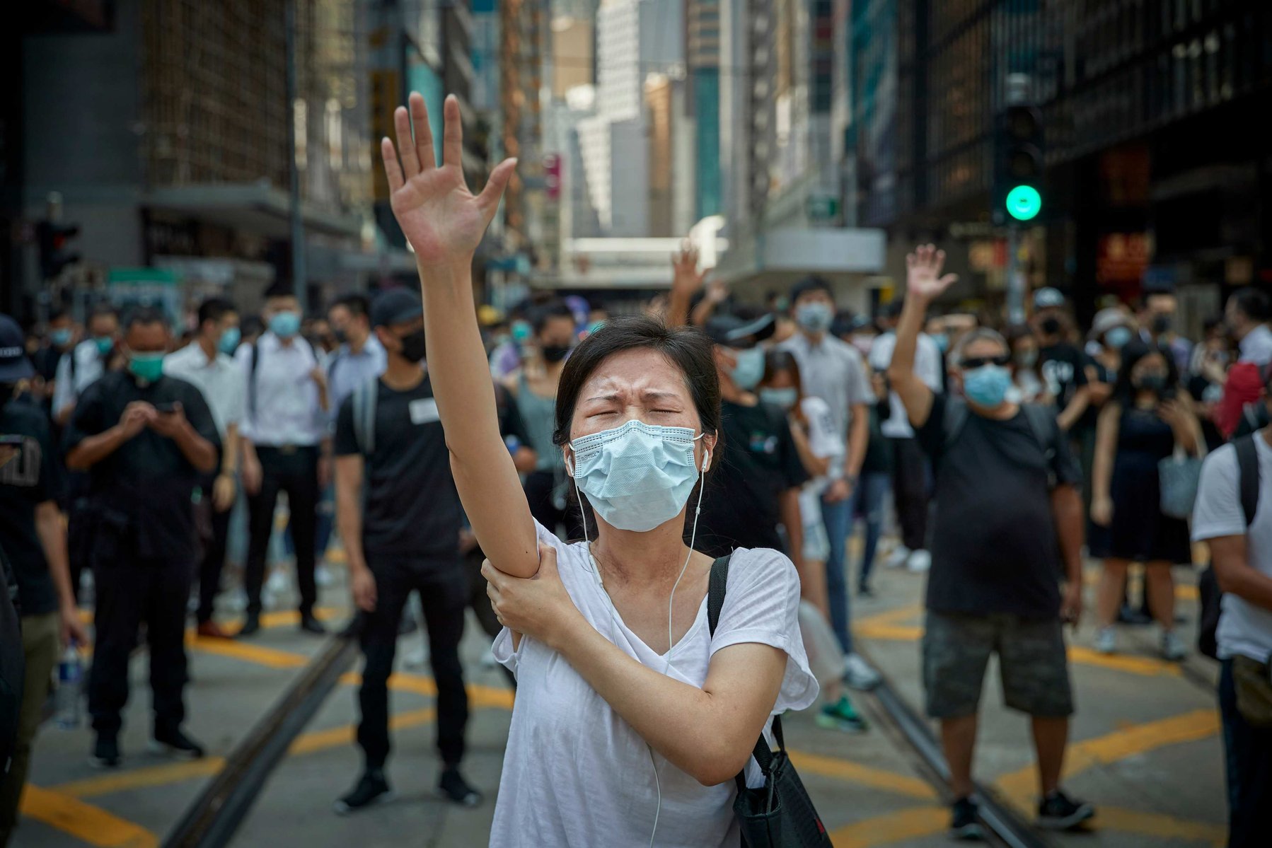 OCTOBER 1, 2019 - HONG KONG SAR: A Pro-democracy protestor holds her hand in the air to represent protestors 'five demands' as people gather in Central Hong Kong to demonstrate against the governments anti-mask law.