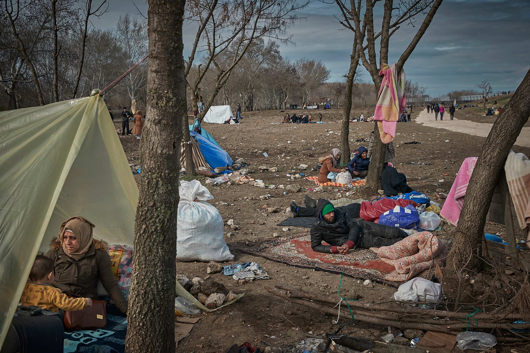 MARCH 5, 2020 - EDIRNE, TURKEY: Refugees in a makeshift camp on the banks near the Edirne Old Bridge as they wait to cross into Greece and the European Union on March 05, 2020 in Edirne, Turkey.