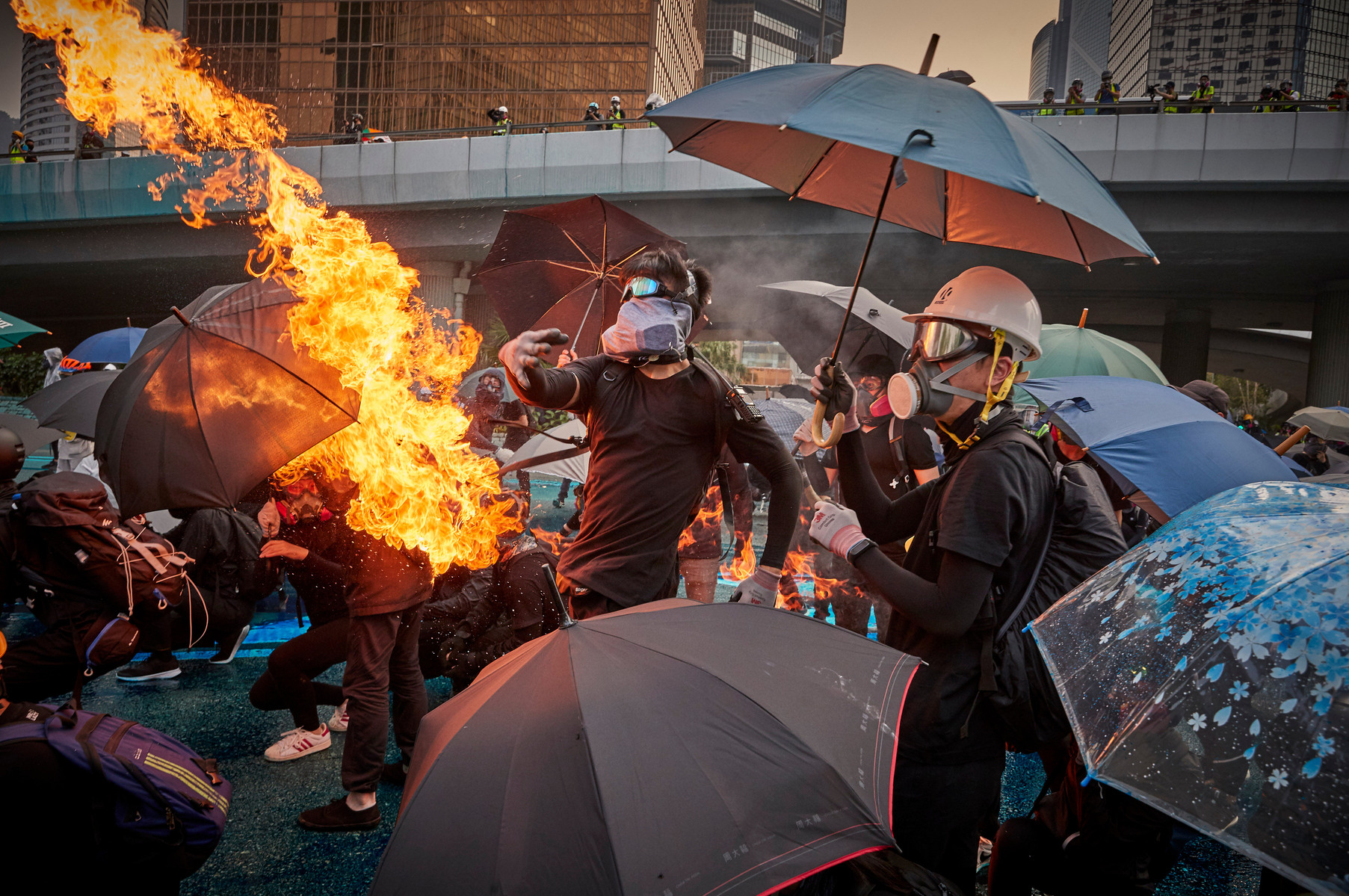 SEPTEMBER 29: A protestor throws a molotov cocktail towards police as protests turn violent during anti-government demonstrations outside the Legco Government buildings, Admiralty, amidst rising tensions in Hong Kong.