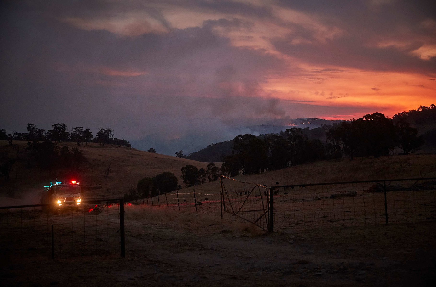 TUMBARUMBA, AUSTRALIA - JANUARY 11, 2020: A Rural Fire Service truck makes its way back from the fire front of the New South Wales 'Mega' fire on the outskirts of the small town of Tumbarumba in the Snowy Mountains, NSW.