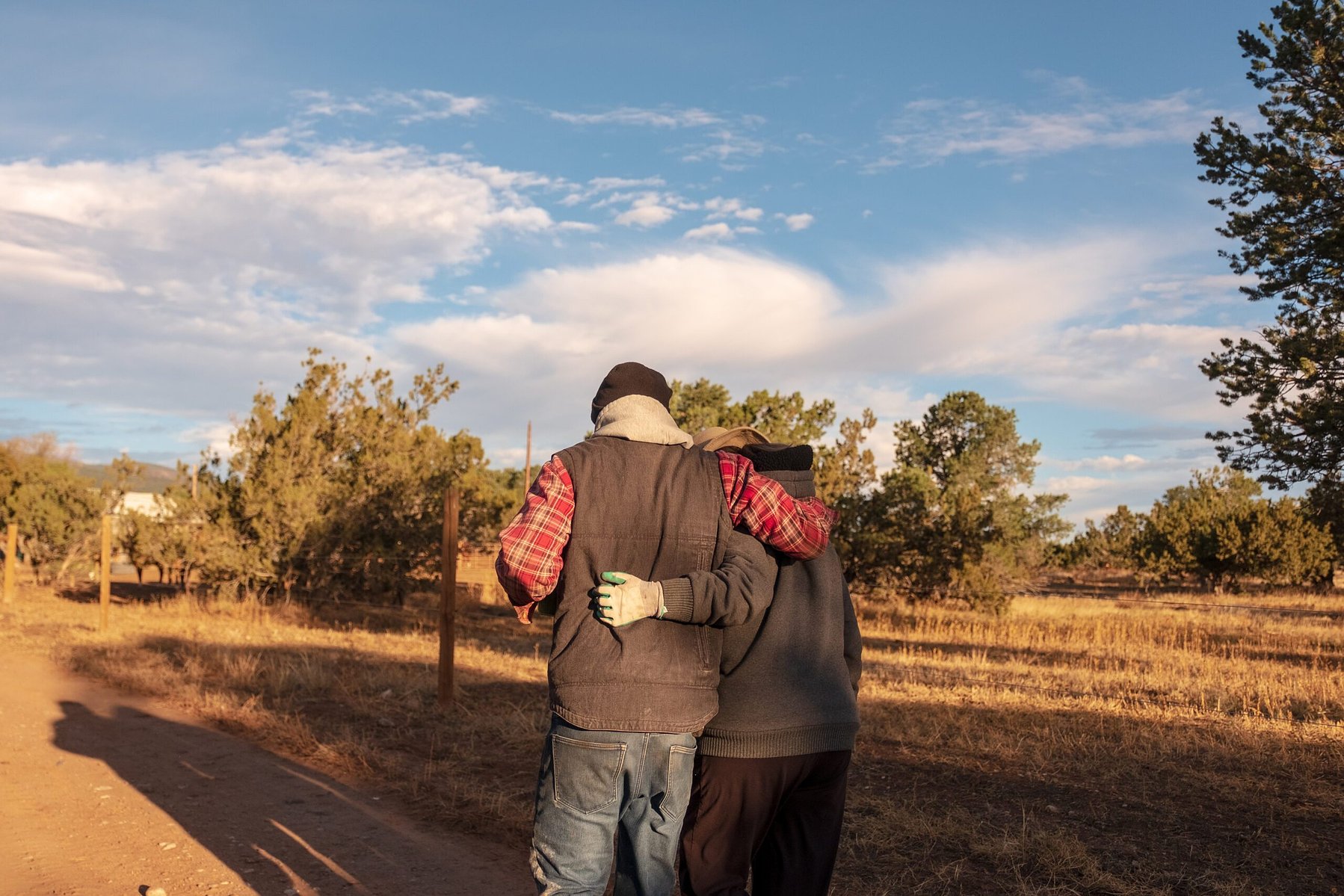 Zach and Ethan both live on the property with their parents, passed down from their grandparents. The brothers grew up on the farm land, which was used as a horse ranch prior to their recent farm. This image shows Zach hugging his mother, Sani Polk, as th