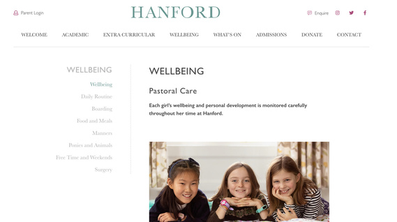 Hanford School website homepage screenshot showing three young girls lying on a bed facing the camera.