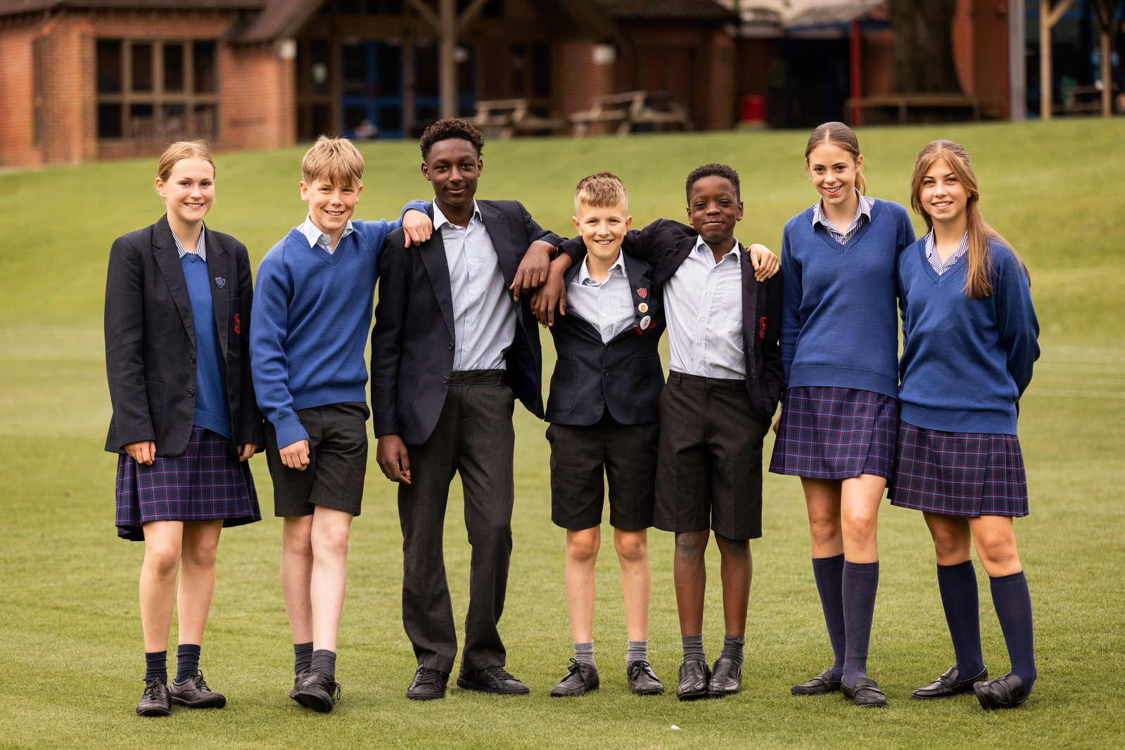 Seven year 8 students stand in a line and pose for the camera at Chafyn Grove School, Salisbury