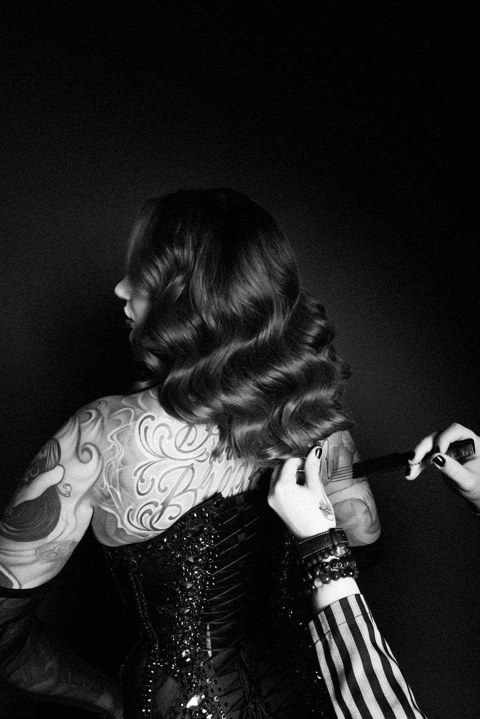 Creative team collaborating with model Cervena Fox during a photo session with NYC-based photographer MFFPHOTOGRAPHY.