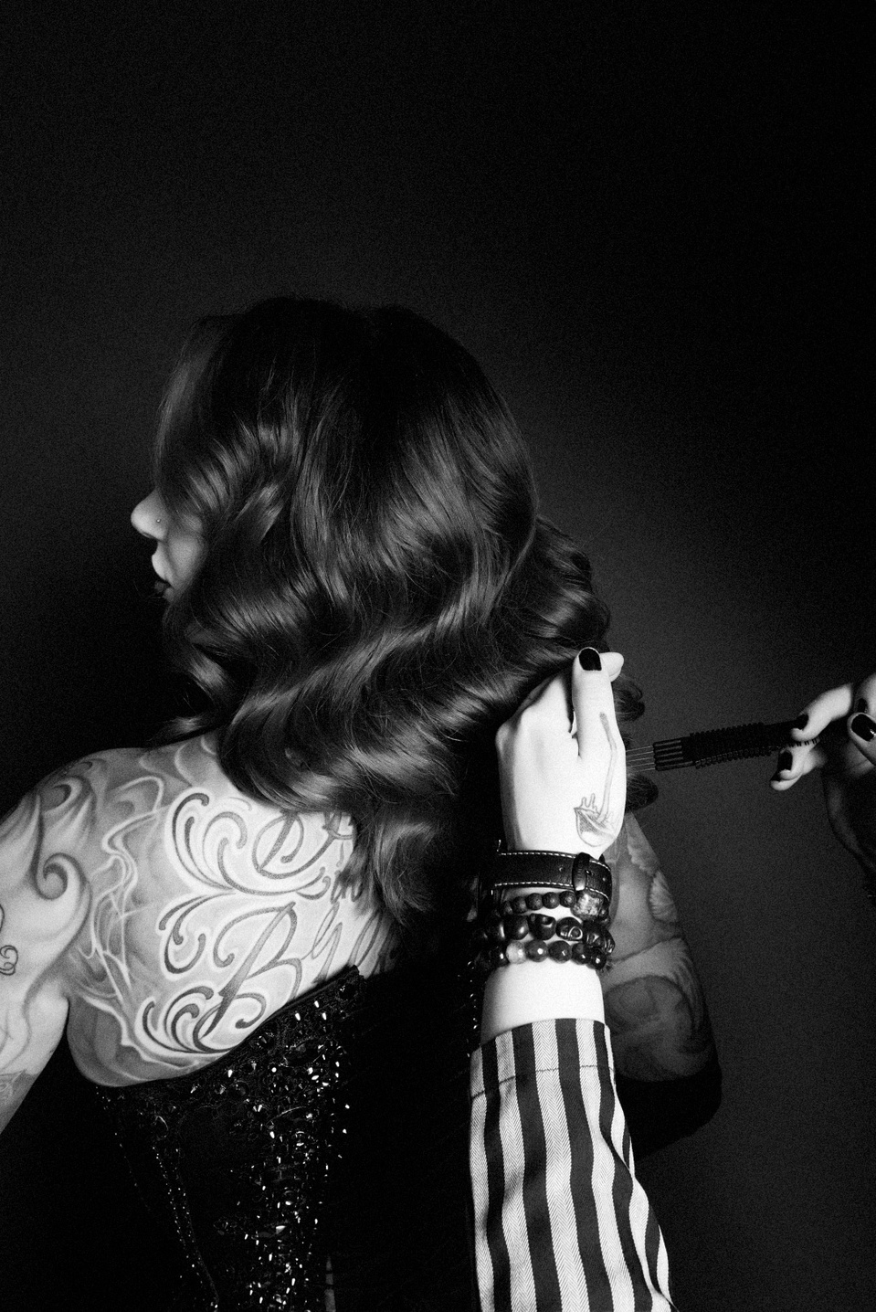 Creative team collaborating with model Cervena Fox during a photo session with NYC-based photographer MFFPHOTOGRAPHY.