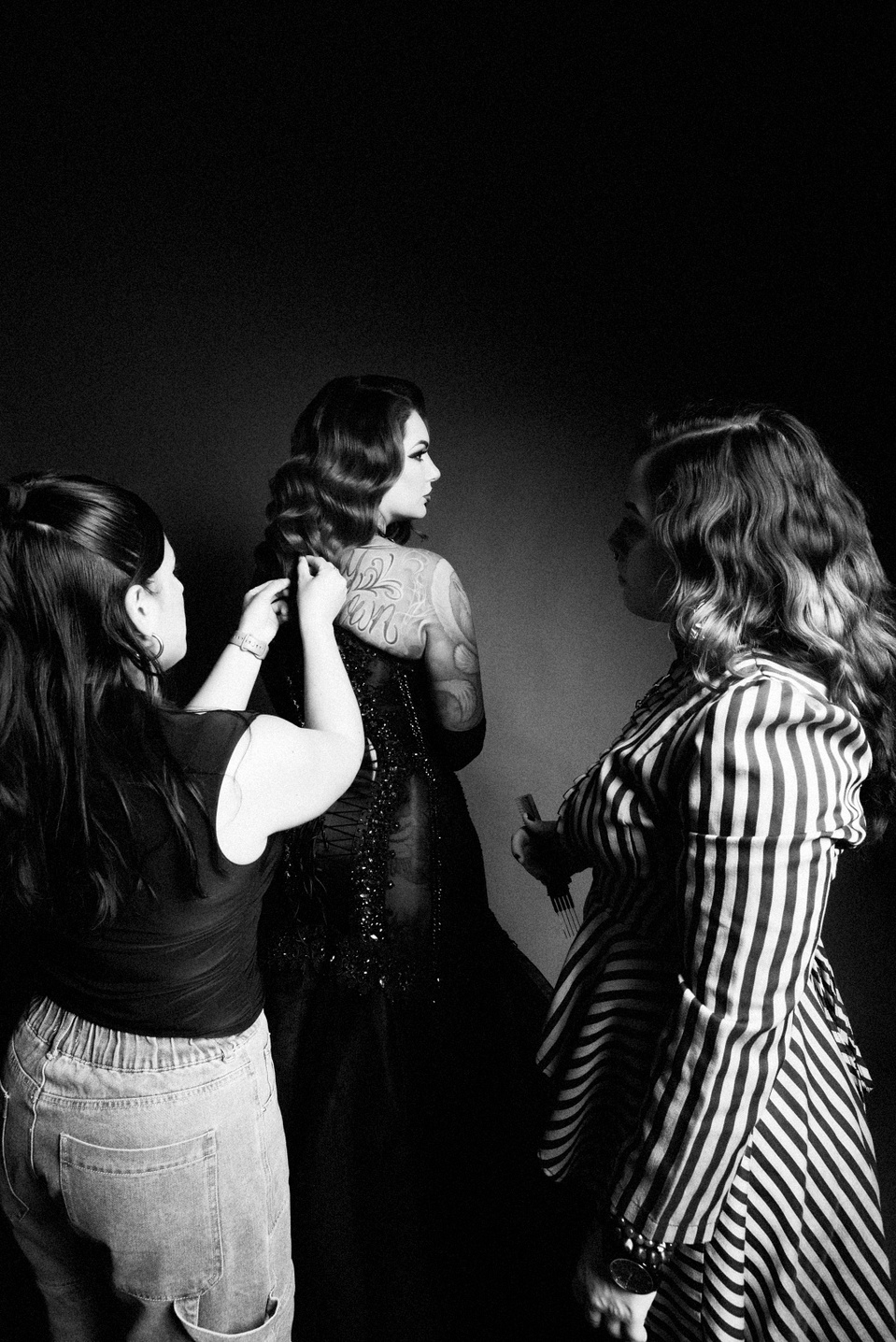 Creative team collaborating with model Cervena Fox during a photo session with NYC-based photographer MFFPHOTOGRAPHY.