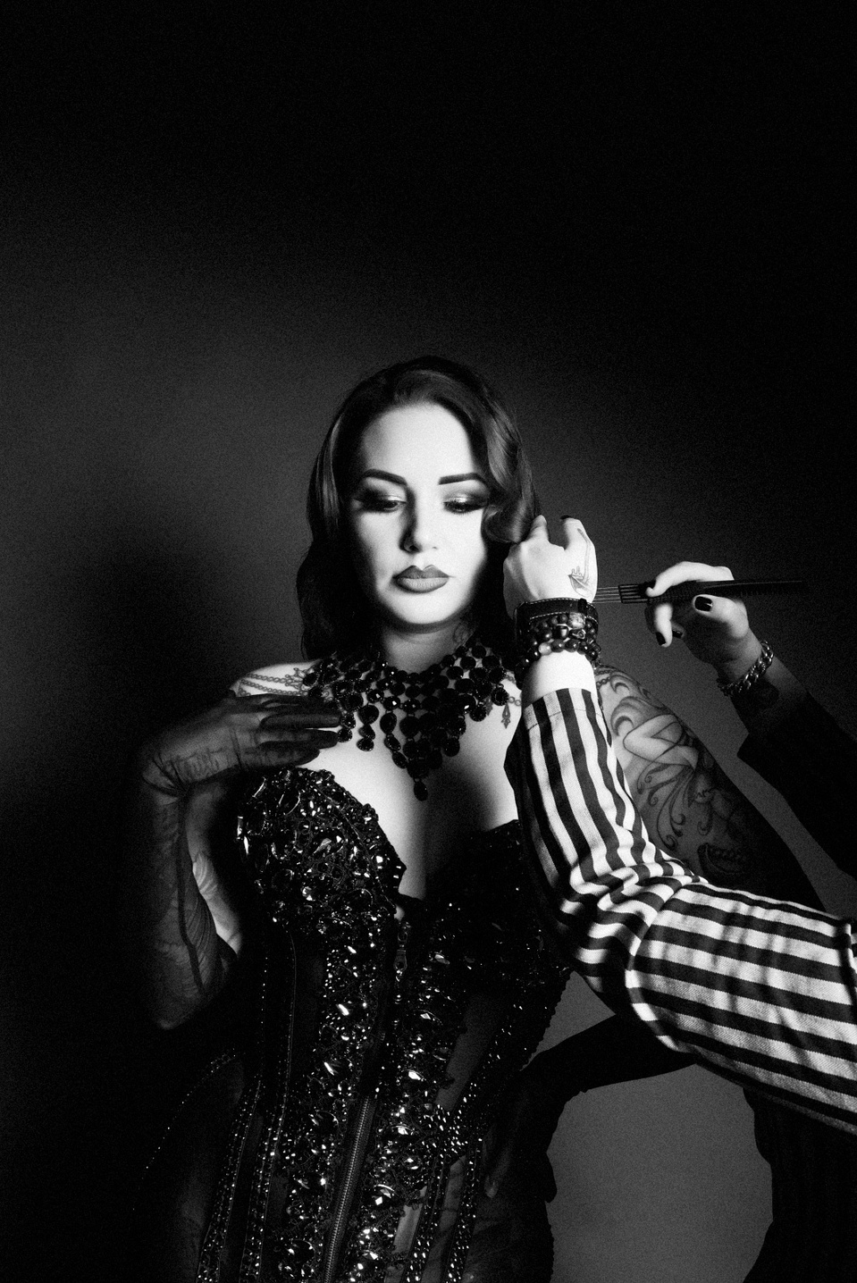 Creative team collaborating with model Cervena Fox during a photo session with NYC-based photographer MFFPHOTOGRAPHY.