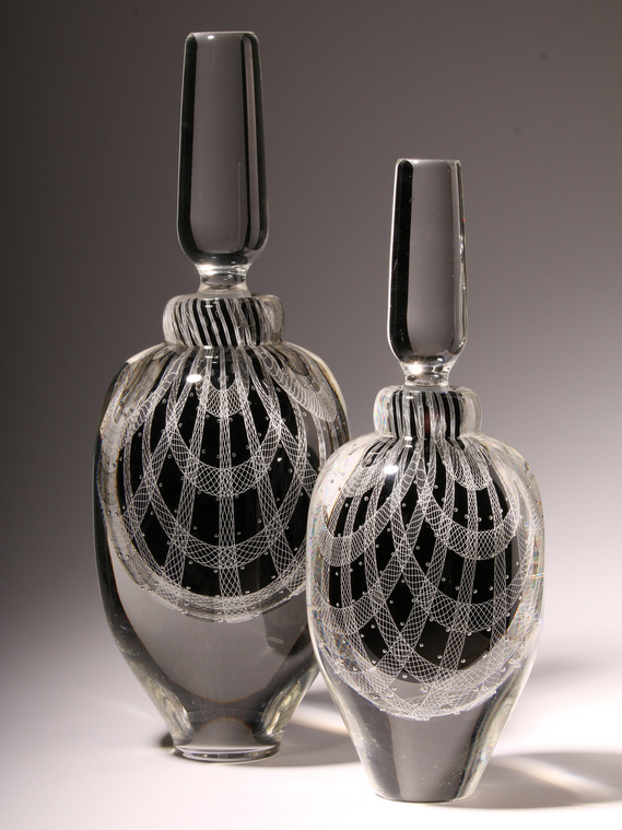 Lines of Inquiry by Peter Bowls.  Two black and white handblown glass vases utilizing merletto and canework glass techniques.