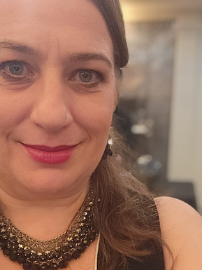 A close-up portrait of the author in October 2023 at a Gatsby-themed gala event in a historical building in downtown Vancouver.