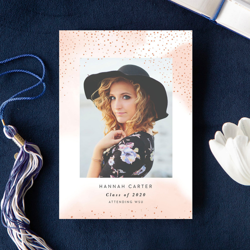 photo of a custom senior photo graduation announcement card with a blue background and tassel surrounding it