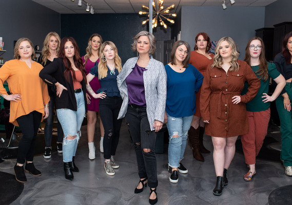 group photo of a team of cosmetologists standing with hands on hips inside a salon at a branding session in Tuttle Oklahoma