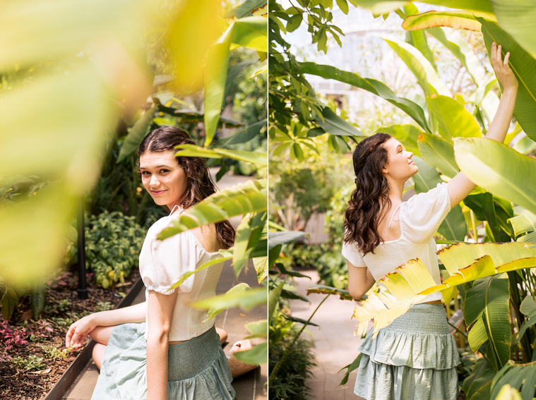 two photos of a high school senior girl with long brown hair wearing a white top and green skirt sitting and standing among big tropical leaves on a path inside the Crystal Bridge at Myriad Gardens in Oklahoma City 