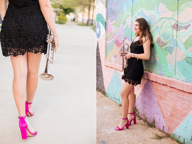 two photos of a high school senior girl wearing a black dress and pink heels holding her trumpet against a mural at Factory Obscura and close up of her walking on  the sidewalk in Automobile Alley in Oklahoma City, Oklahoma