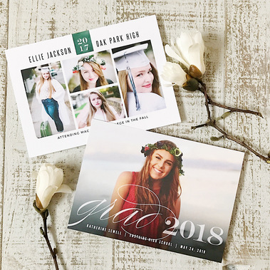 photo of 2 custom grad announcement cards with senior photos on them surrounded by white flowers